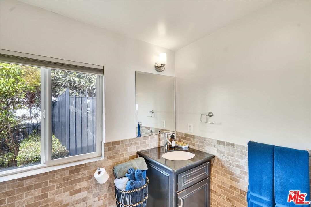 3966 Las Flores Canyon Road Malibu, CA 90265 - Photo 37 of 53 a bathroom with a sink double vanity and a mirror