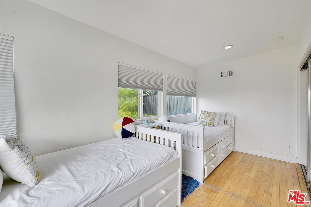 3966 Las Flores Canyon Road Malibu, CA 90265 - Photo 38 of 53 a bedroom with a bed and a large window