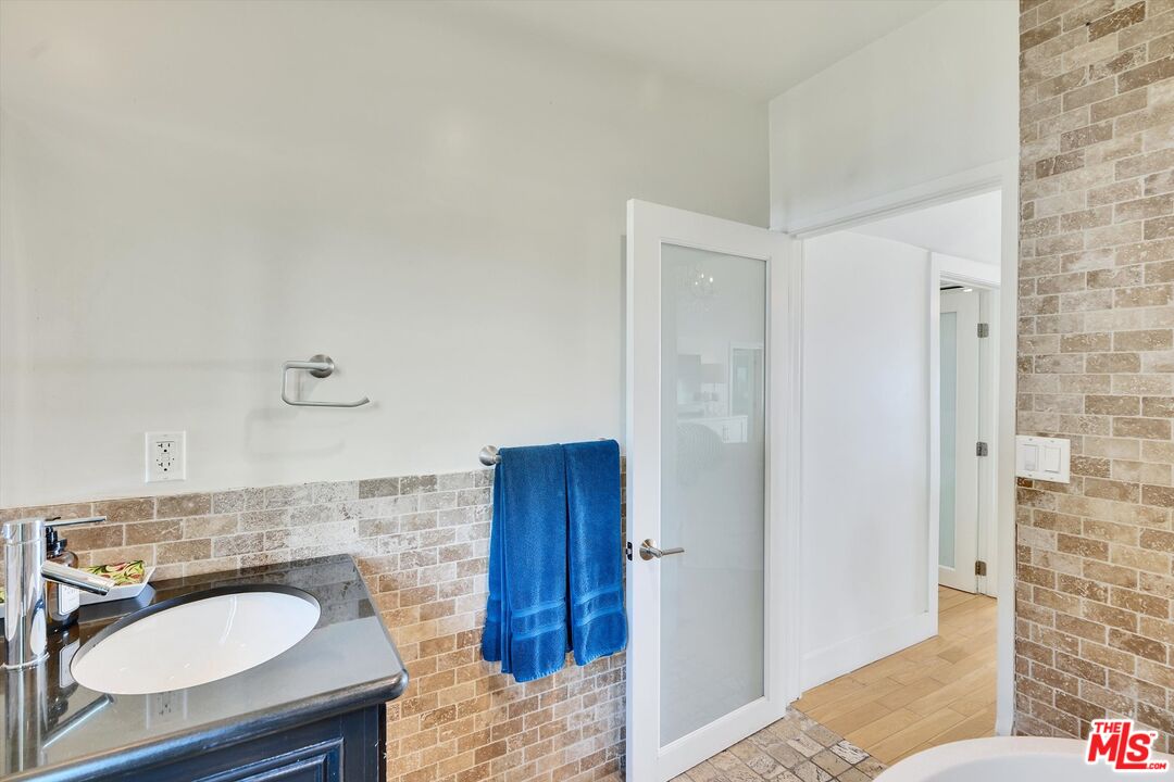 3966 Las Flores Canyon Road Malibu, CA 90265 - Photo 38 of 53 a bathroom with a sink and a mirror
