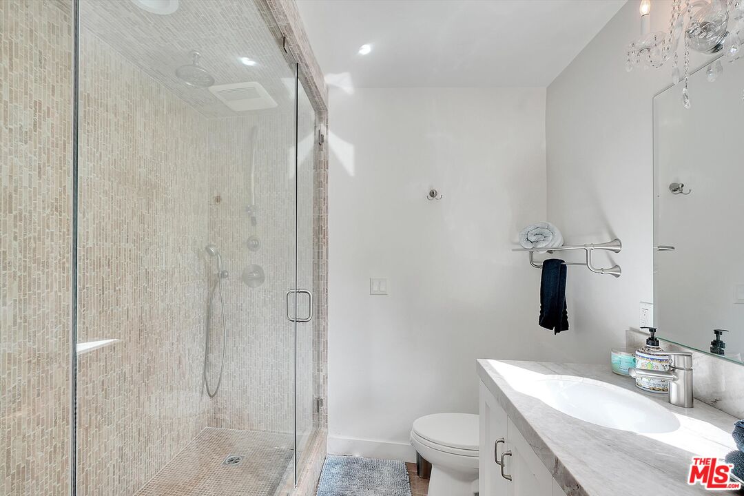 3966 Las Flores Canyon Road Malibu, CA 90265 - Photo 44 of 53 a bathroom with a granite countertop sink a toilet and shower