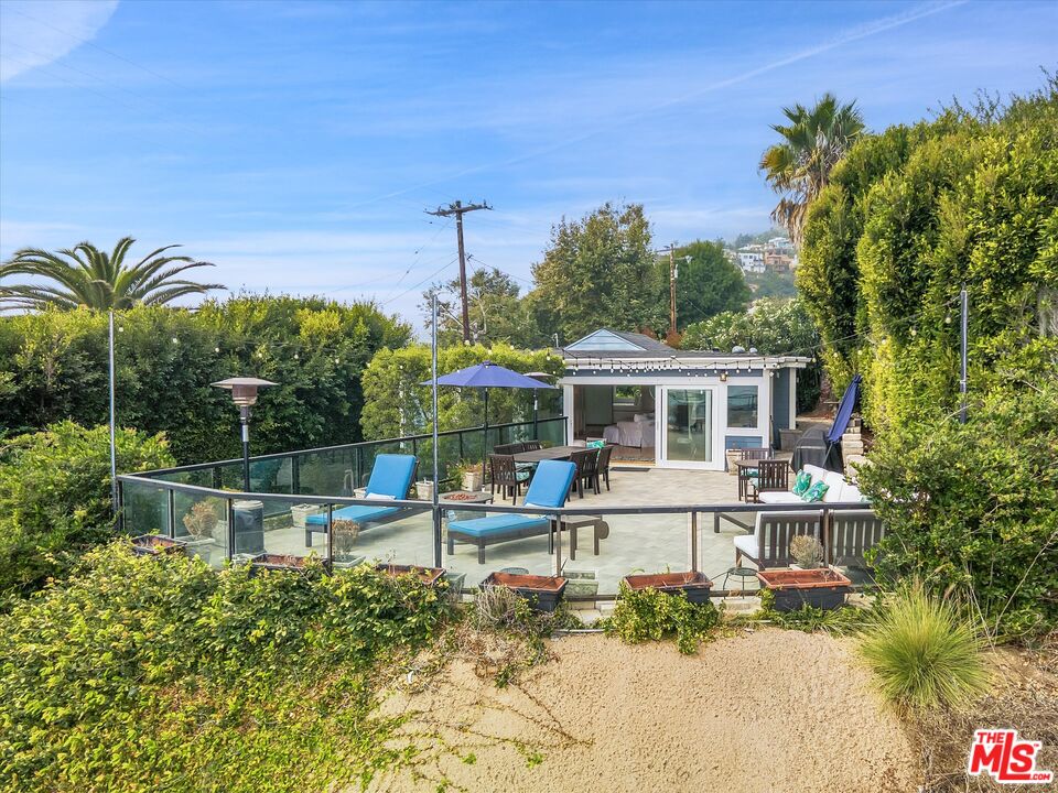 3966 Las Flores Canyon Road Malibu, CA 90265 - Photo 48 of 53 a front view of a house with a garden