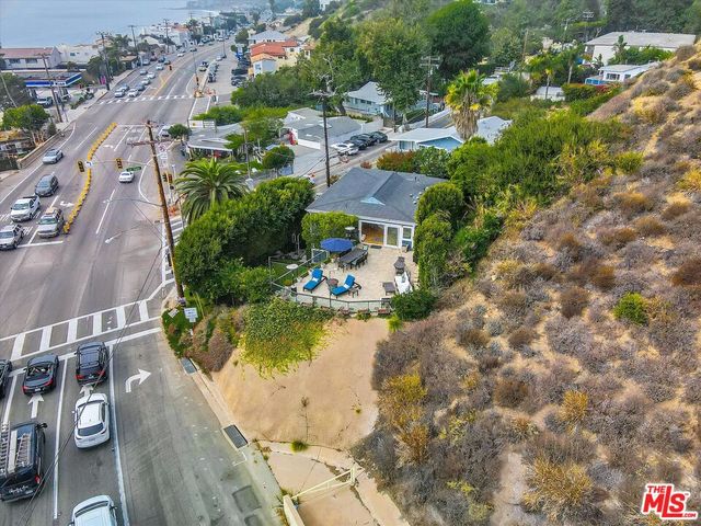 an aerial view of a house with a swimming pool