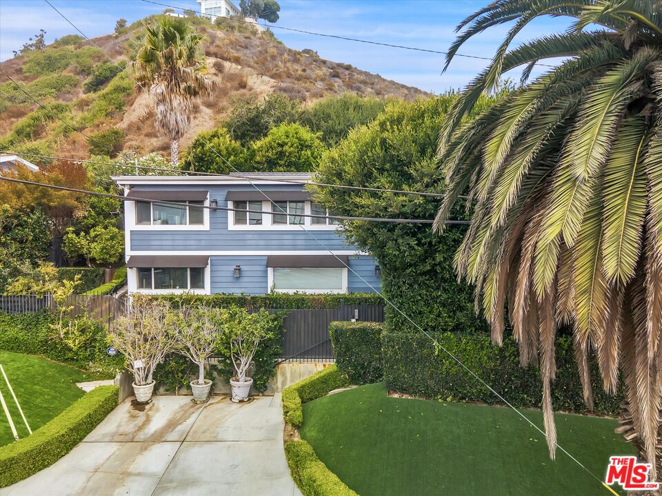 3966 Las Flores Canyon Road Malibu, CA 90265 - Photo 5 of 53 a view of a house with a backyard
