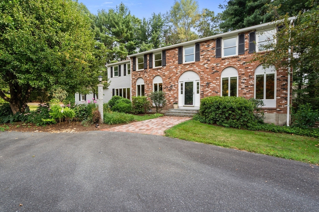 1 Pueblo Road Medfield, MA 02052 - Photo 2 of 36 a front view of a house with a yard and garage