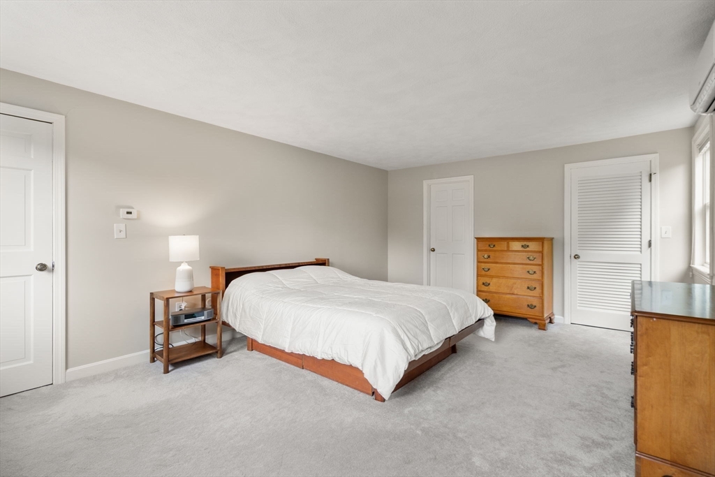 1 Pueblo Road Medfield, MA 02052 - Photo 22 of 36 a bedroom with a bed and a view of kitchen
