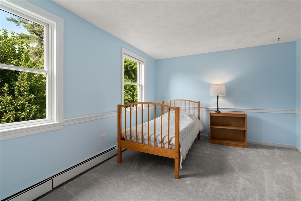 1 Pueblo Road Medfield, MA 02052 - Photo 27 of 36 a spacious bedroom with a bed and a window