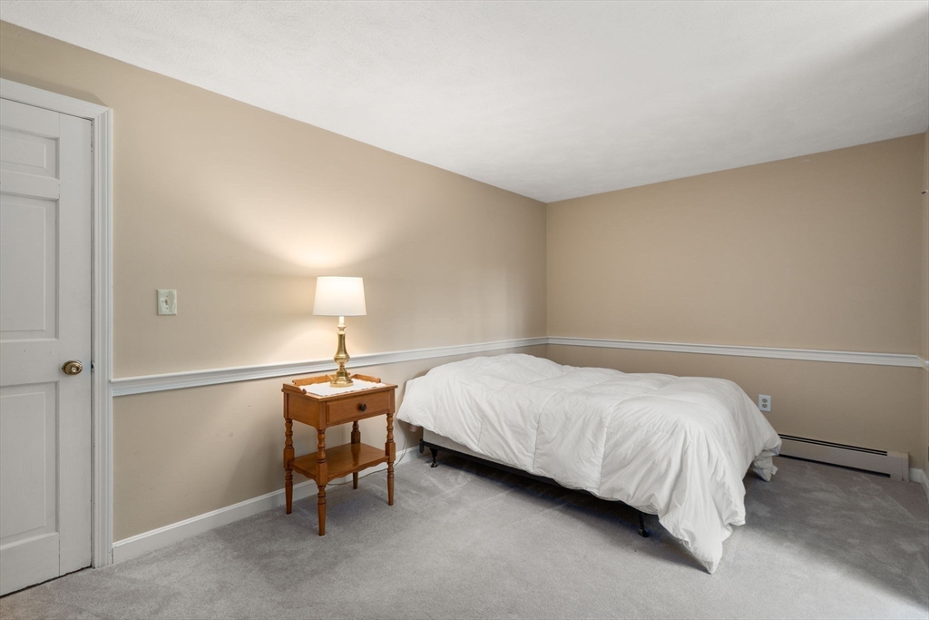 1 Pueblo Road Medfield, MA 02052 - Photo 28 of 36 a bedroom with a bed and lamp on desk
