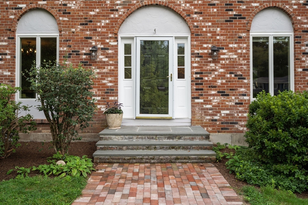 1 Pueblo Road Medfield, MA 02052 - Photo 4 of 36 a front view of a house with garden