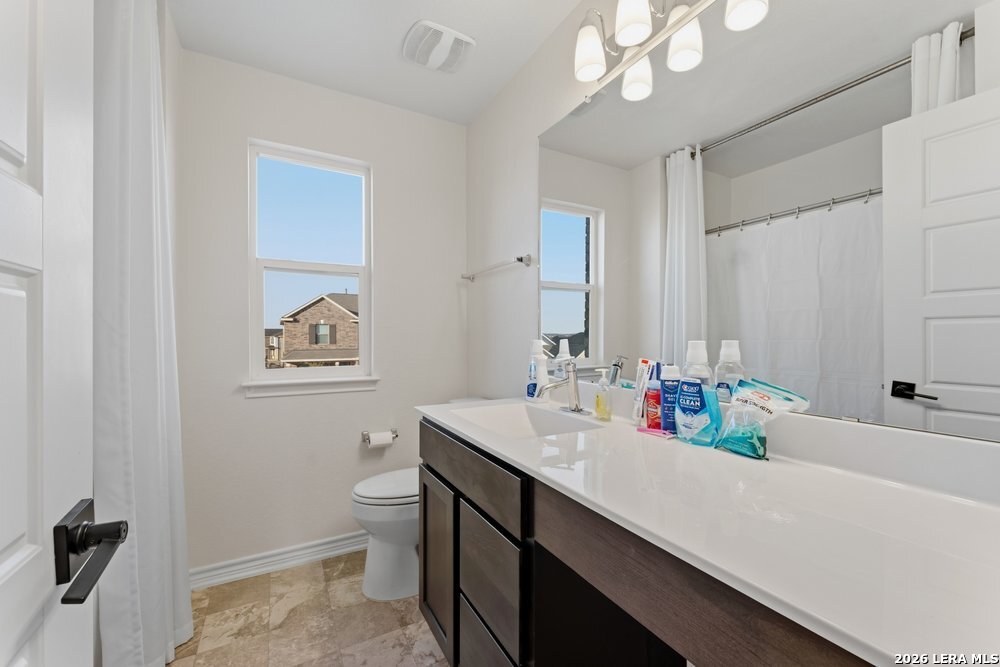 9422 Braman Converse, TX 78109 - Photo 22 of 26 a bathroom with a sink a toilet and a mirror