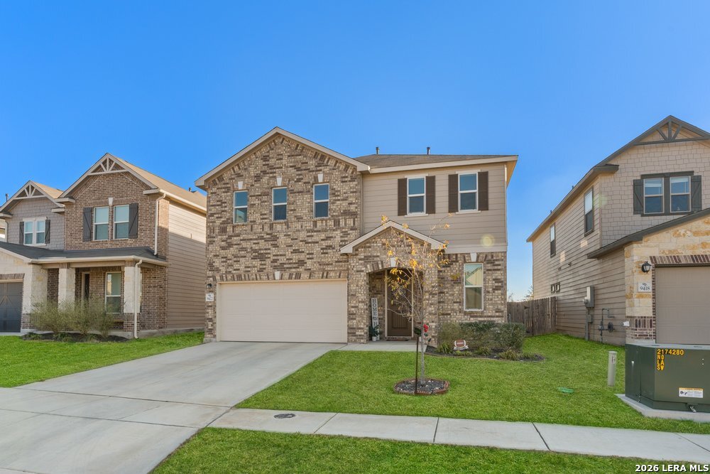 9422 Braman Converse, TX 78109 - Photo 3 of 26 a front view of a house with a garden