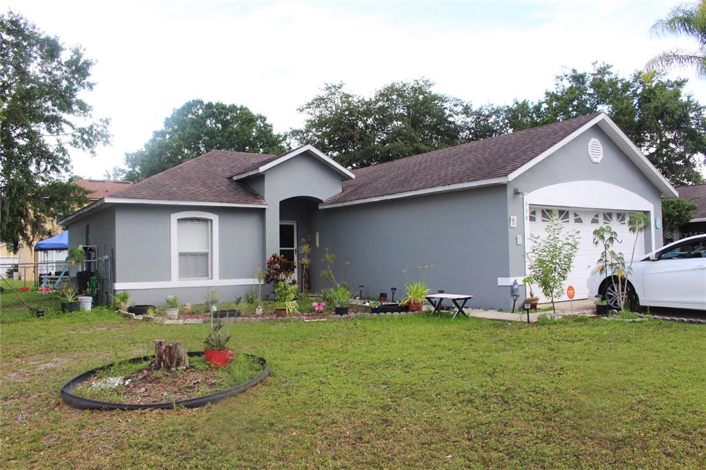 a front view of a house with garden