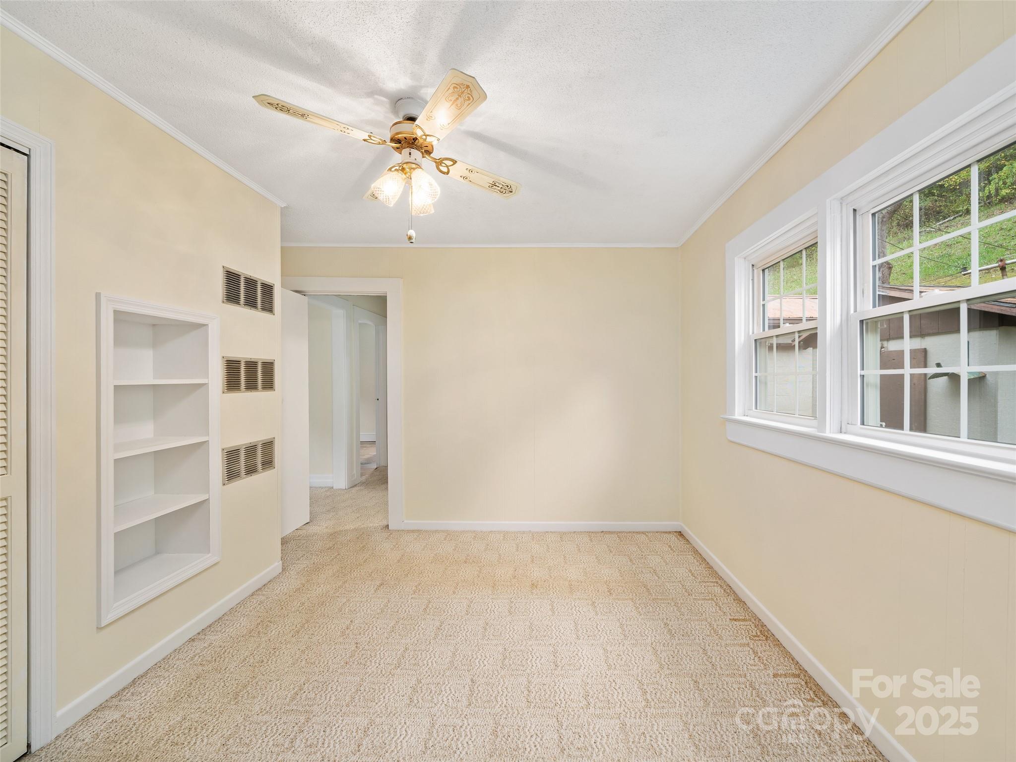338 Sweet Creek Road Bakersville, NC 28705 - Photo 11 of 21 a view of an empty room with a window