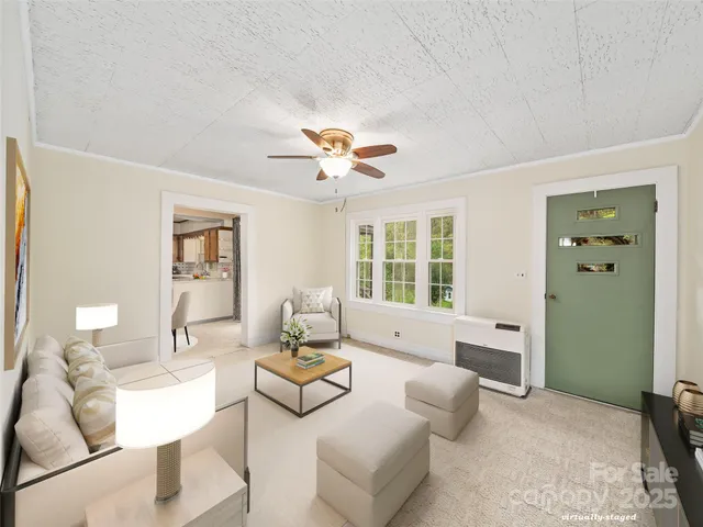 a living room with furniture and a large window