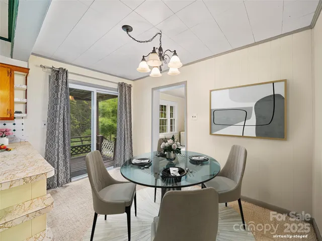 a view of a dining room with furniture window and outside view