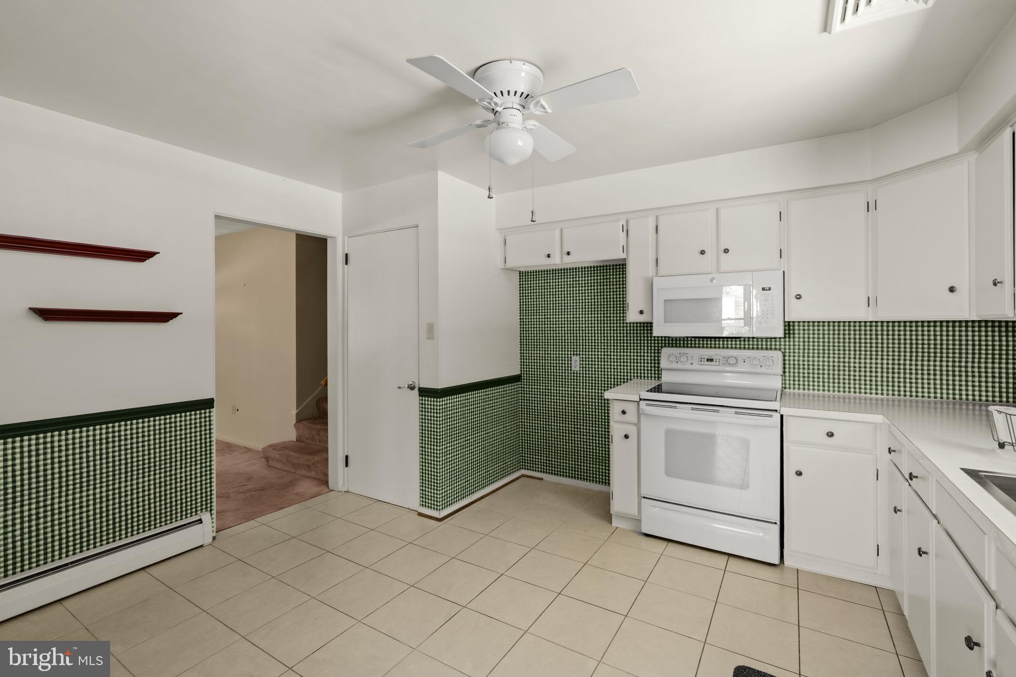 4107 Trowbridge Road York, PA 17402 - Photo 8 of 50 Charming kitchen with green accents.