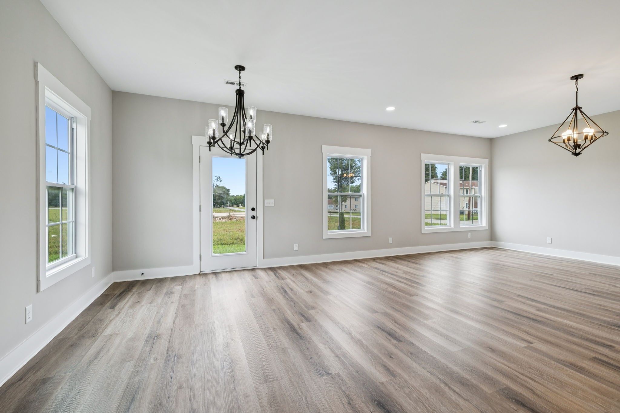 700 Robinson Road Smithville, TN 37166 - Photo 12 of 36 a view of an empty room with wooden floor and a window