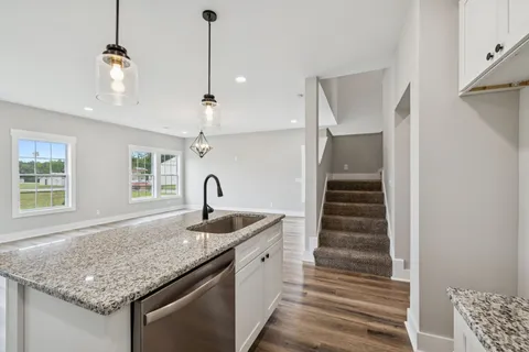 a kitchen with sink and window