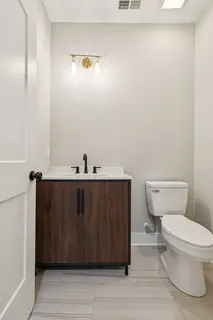 a bathroom with a toilet and a sink