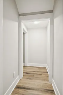 a view of room with wooden floor