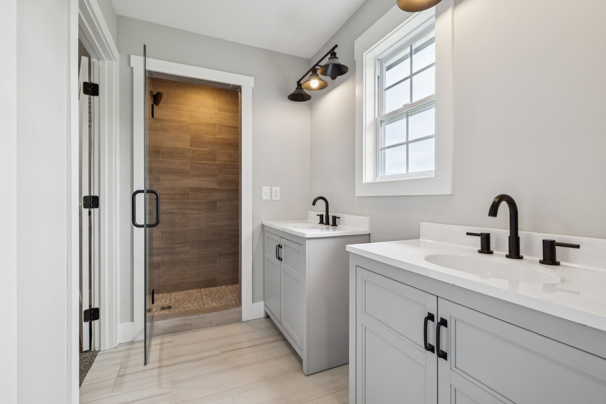 700 Robinson Road Smithville, TN 37166 - Photo 24 of 36 a bathroom with a double vanity sink a mirror and shower