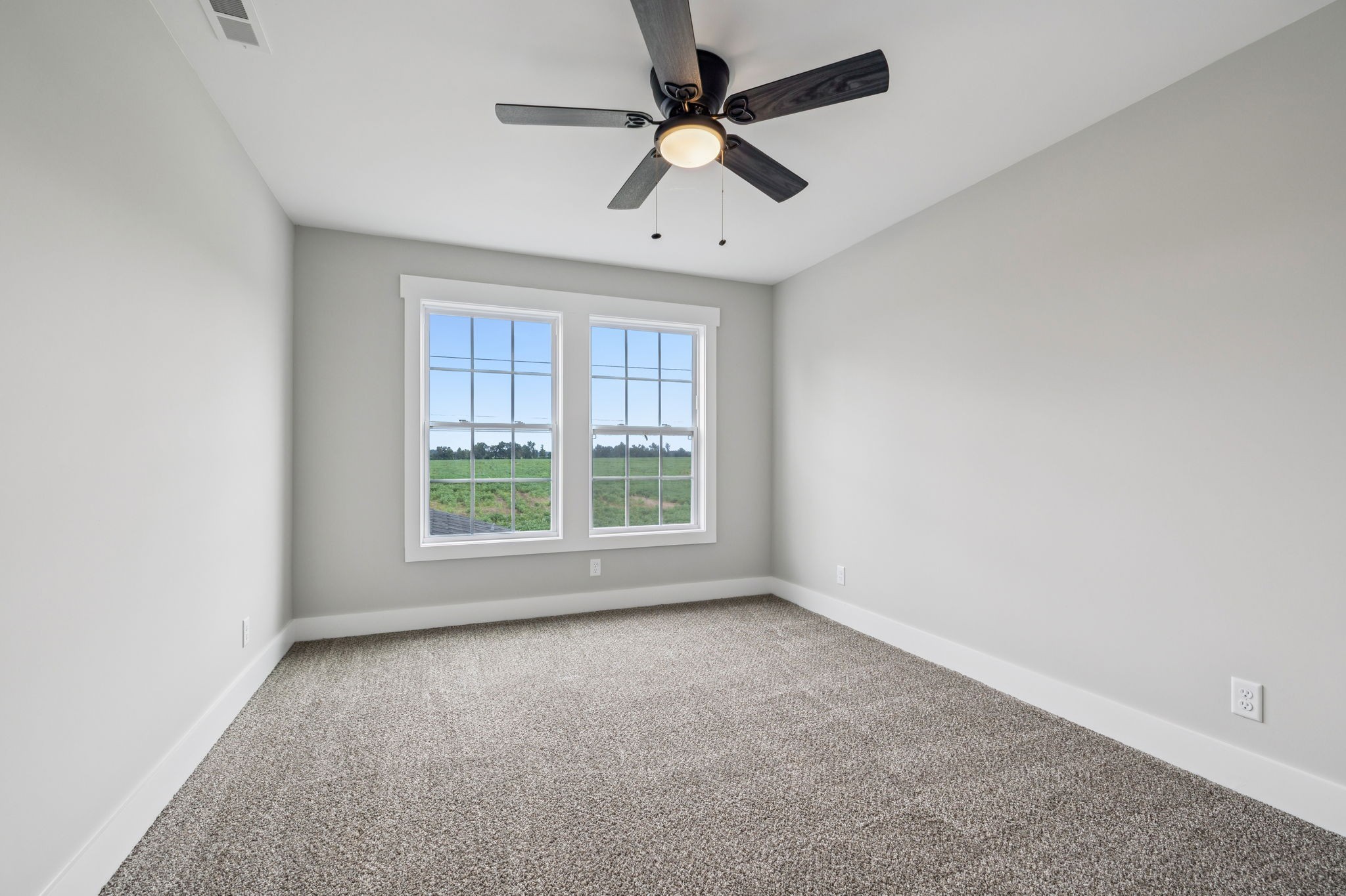 700 Robinson Road Smithville, TN 37166 - Photo 31 of 36 an empty room with a window and a fan
