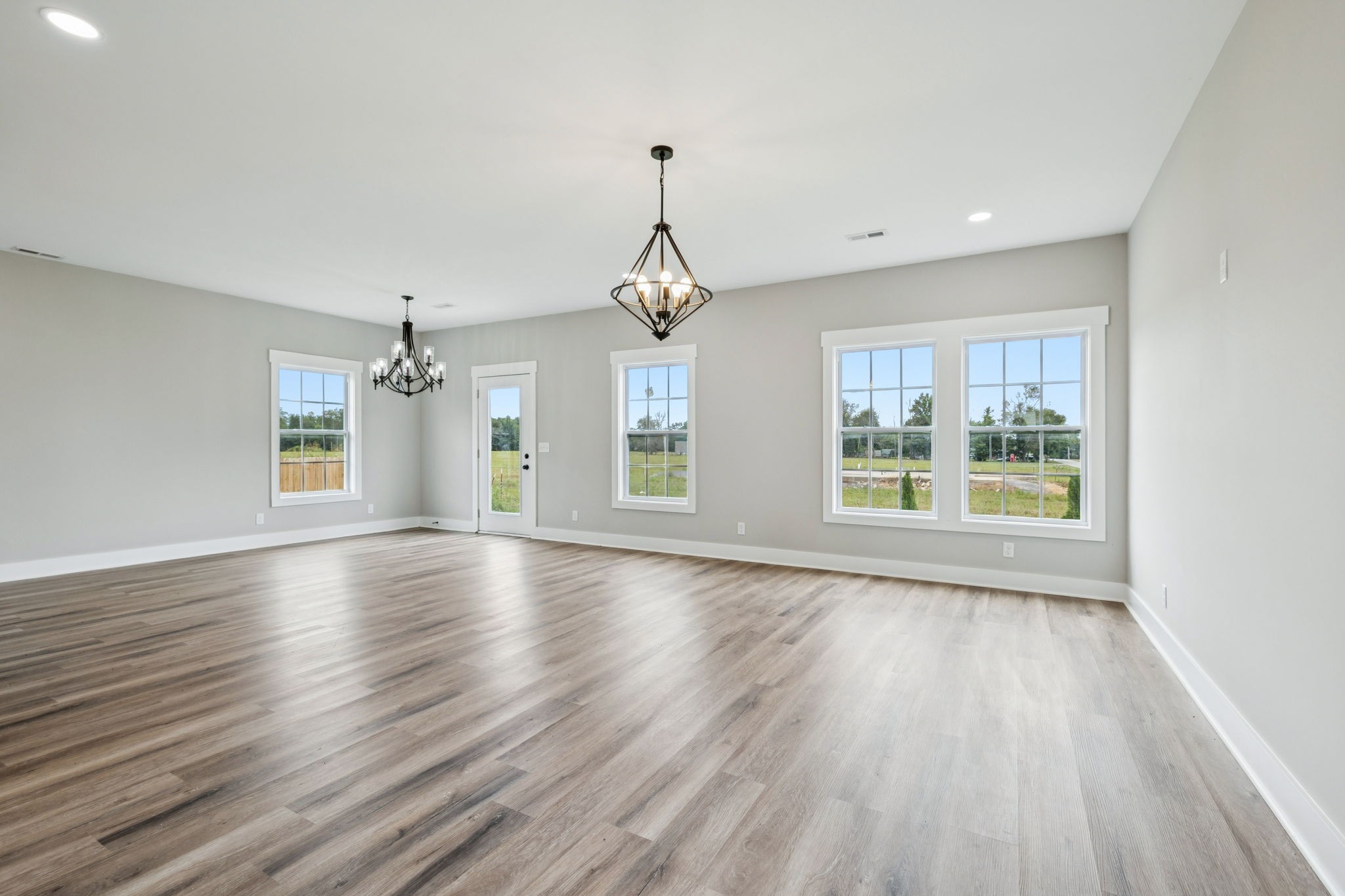 700 Robinson Road Smithville, TN 37166 - Photo 7 of 36 a view of an empty room with wooden floor and a window