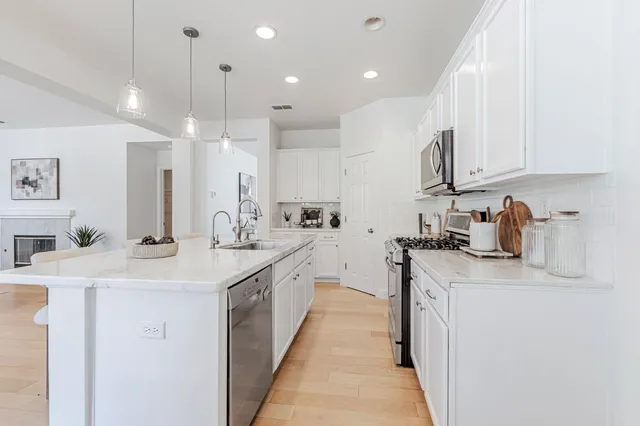 a dining room with furniture and window