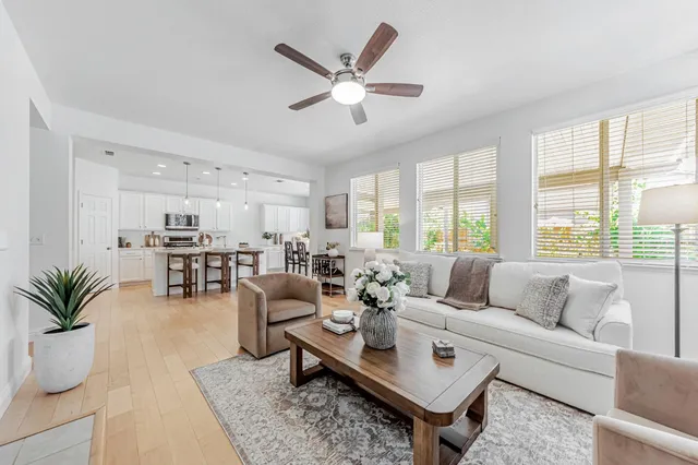 a bedroom with a bed a couch and a window