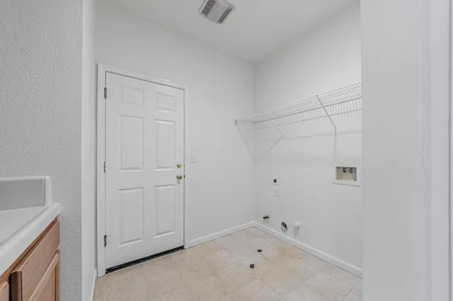 a bed room with a bed and a window