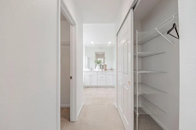 a view of a hallway with paintings on the wall