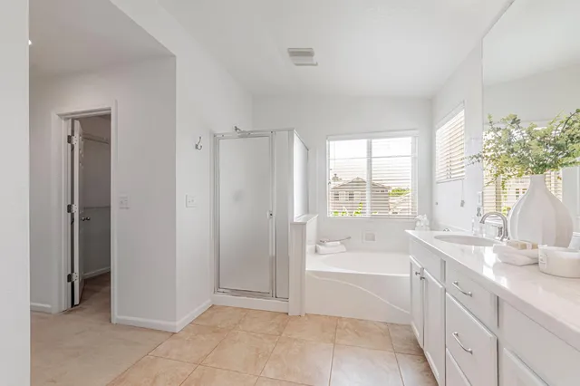 a white toilet sitting next to a bath tub