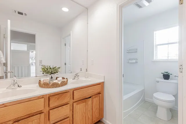 a dining room with furniture and garden view