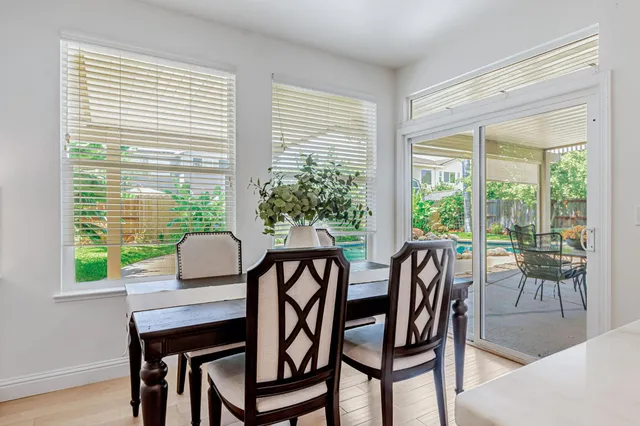 a view of a dining room with furniture window and outside view