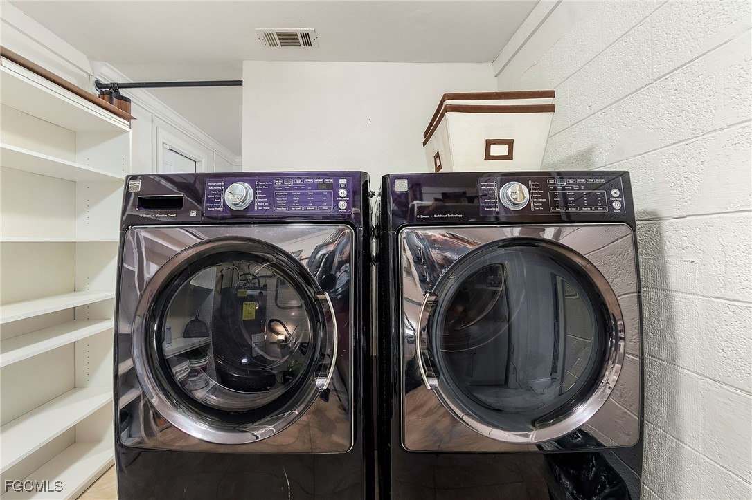 5730 Winkler Road Fort Myers, FL 33919 - Photo 12 of 37 a utility room with dryer and washer