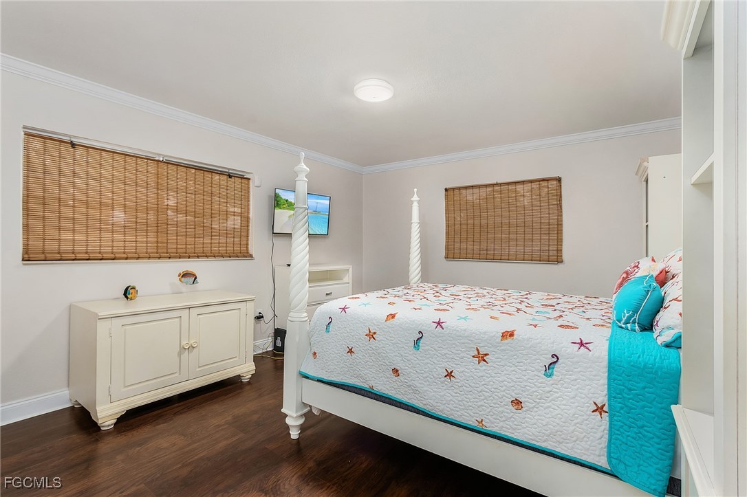 5730 Winkler Road Fort Myers, FL 33919 - Photo 20 of 37 a bedroom with a bed and a window