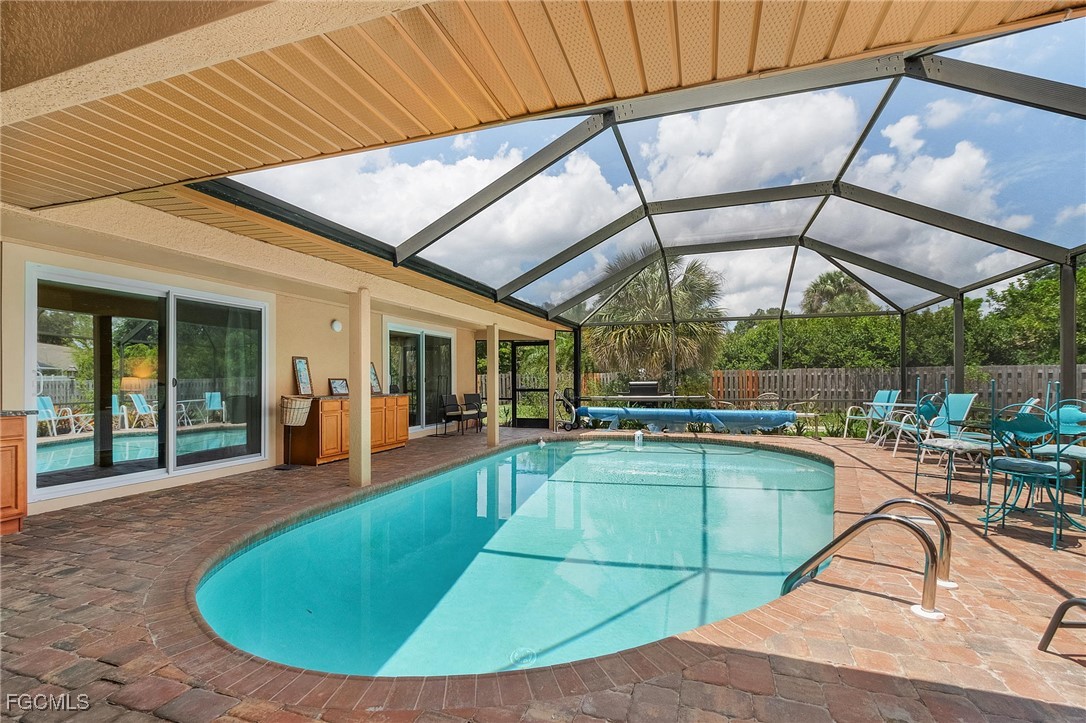 5730 Winkler Road Fort Myers, FL 33919 - Photo 25 of 37 a view of a swimming pool with a lounge chairs