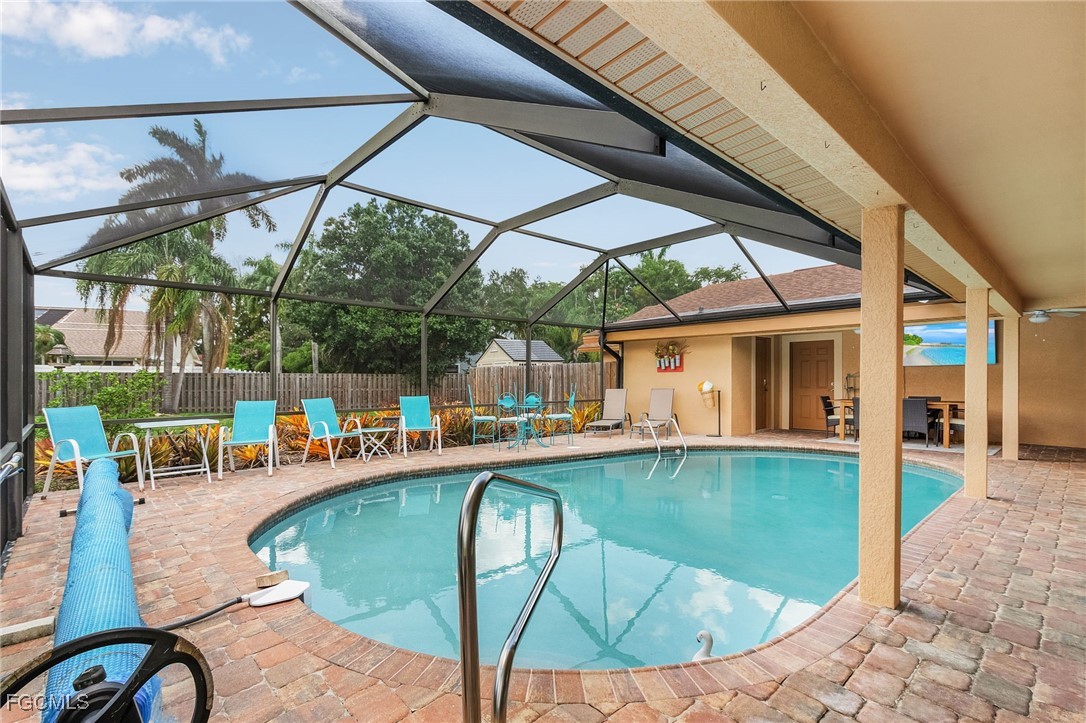 5730 Winkler Road Fort Myers, FL 33919 - Photo 26 of 37 a view of a swimming pool with a porch