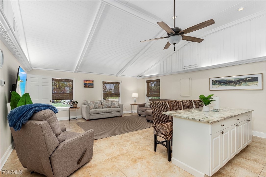 5730 Winkler Road Fort Myers, FL 33919 - Photo 29 of 37 a living room with furniture and a chandelier