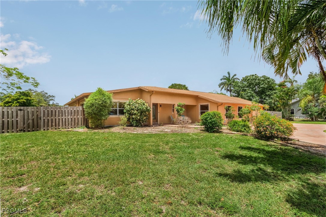 5730 Winkler Road Fort Myers, FL 33919 - Photo 33 of 37 a view of a house with a yard and potted plants