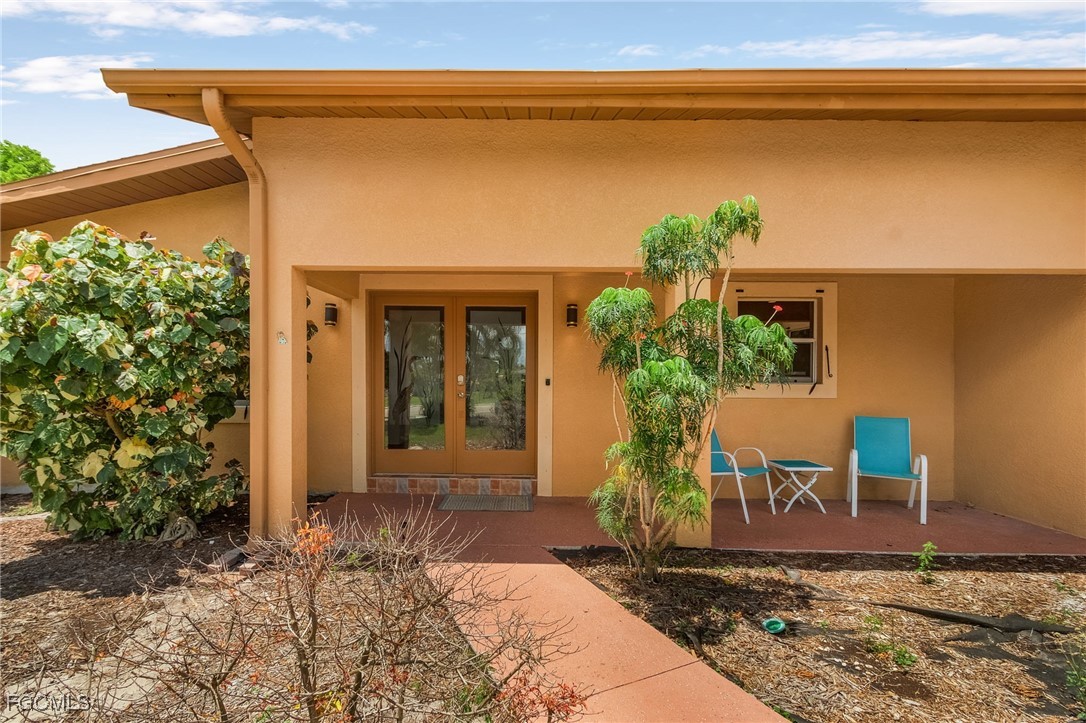 5730 Winkler Road Fort Myers, FL 33919 - Photo 34 of 37 a front view of a house with garden