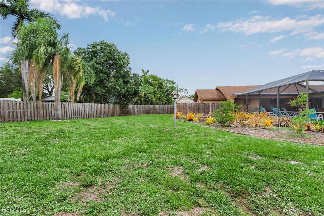 5730 Winkler Road Fort Myers, FL 33919 - Photo 35 of 37 a view of backyard with swimming pool and green space