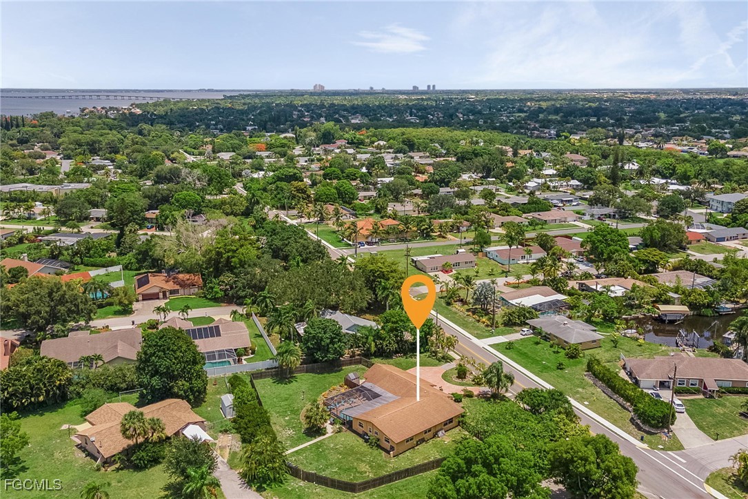 5730 Winkler Road Fort Myers, FL 33919 - Photo 36 of 37 an aerial view of residential houses with outdoor space and trees