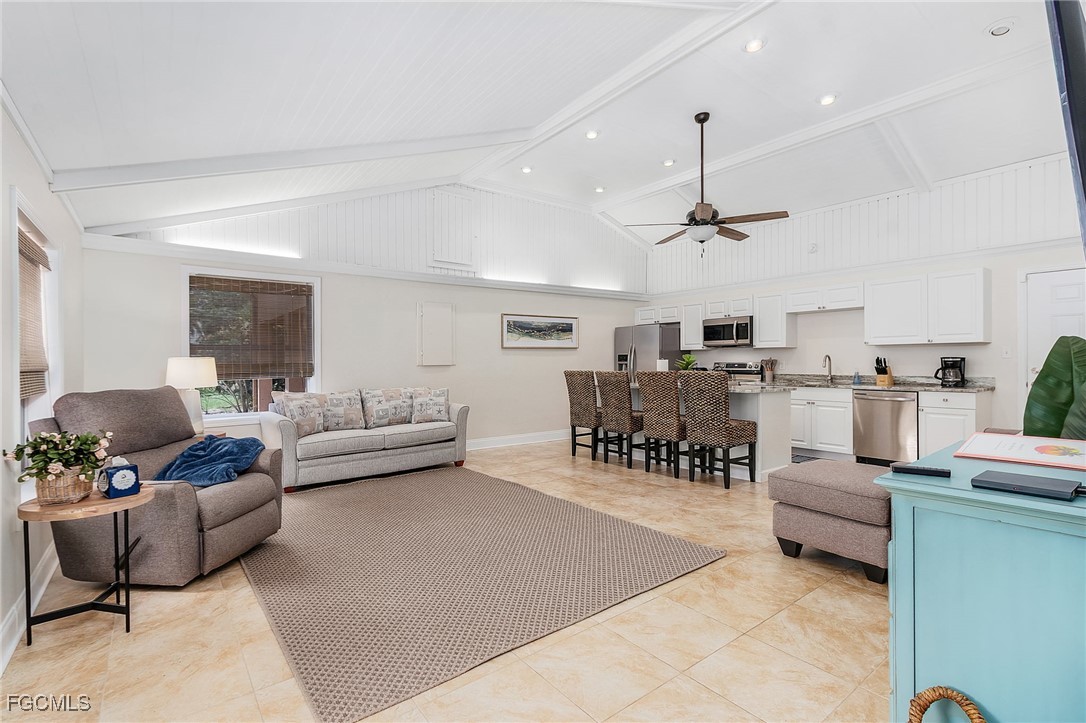 5730 Winkler Road Fort Myers, FL 33919 - Photo 7 of 37 a living room with furniture and kitchen view