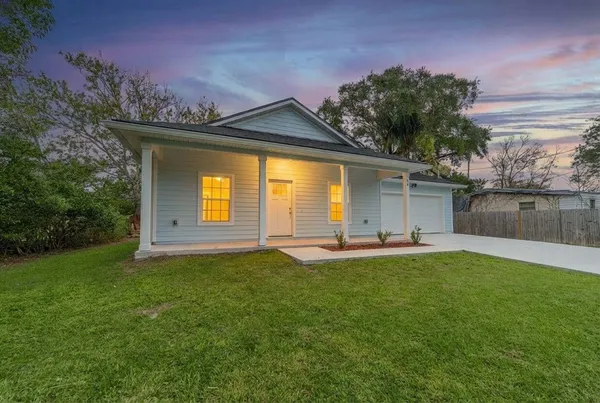 front view of a house with a yard