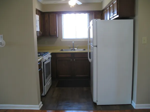 a kitchen with a stove and a microwave