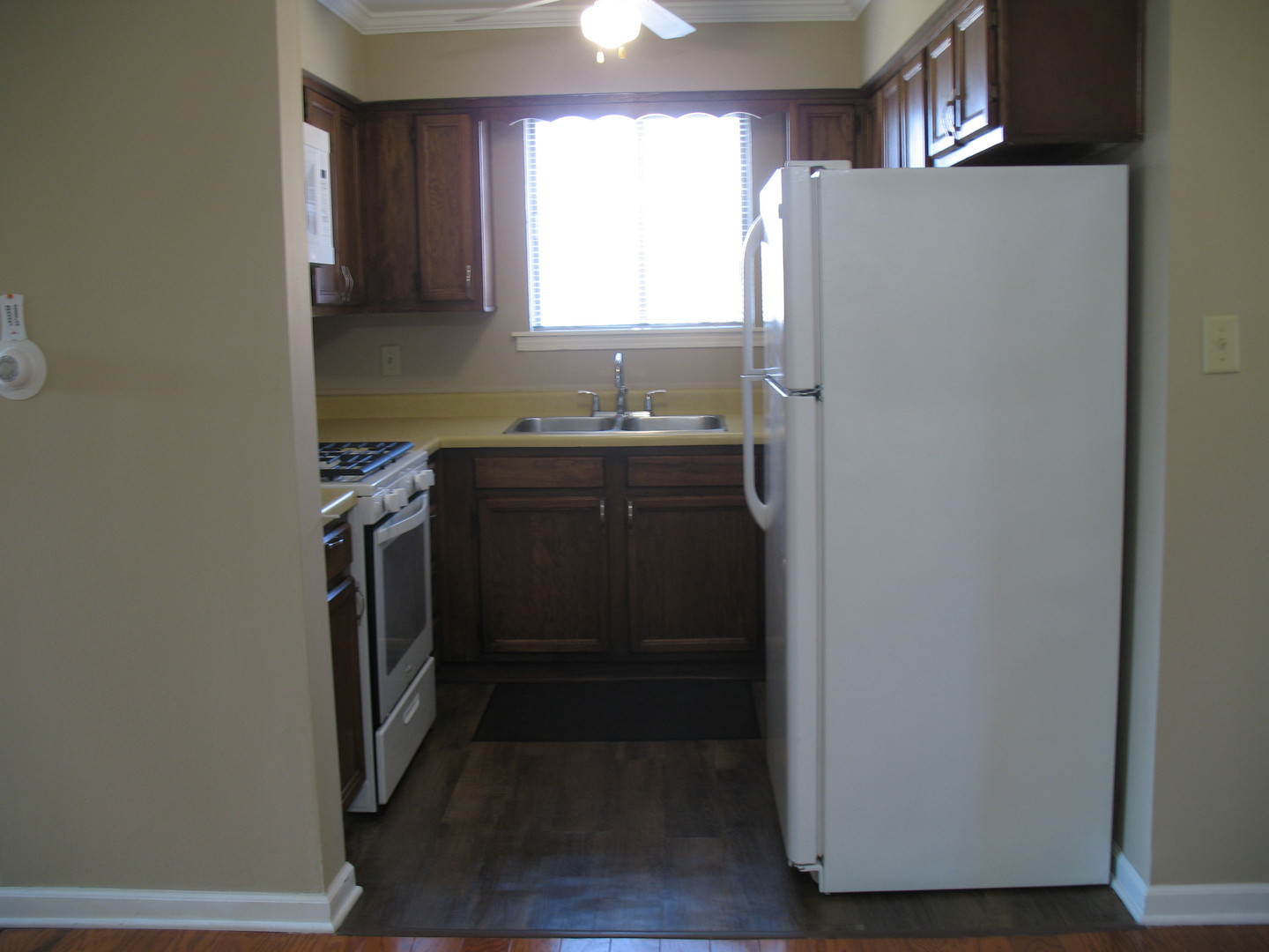 709 65th Street, Unit 5 Westmont, IL 60559 - Photo 6 of 15 a kitchen with stainless steel appliances granite countertop a refrigerator and a sink