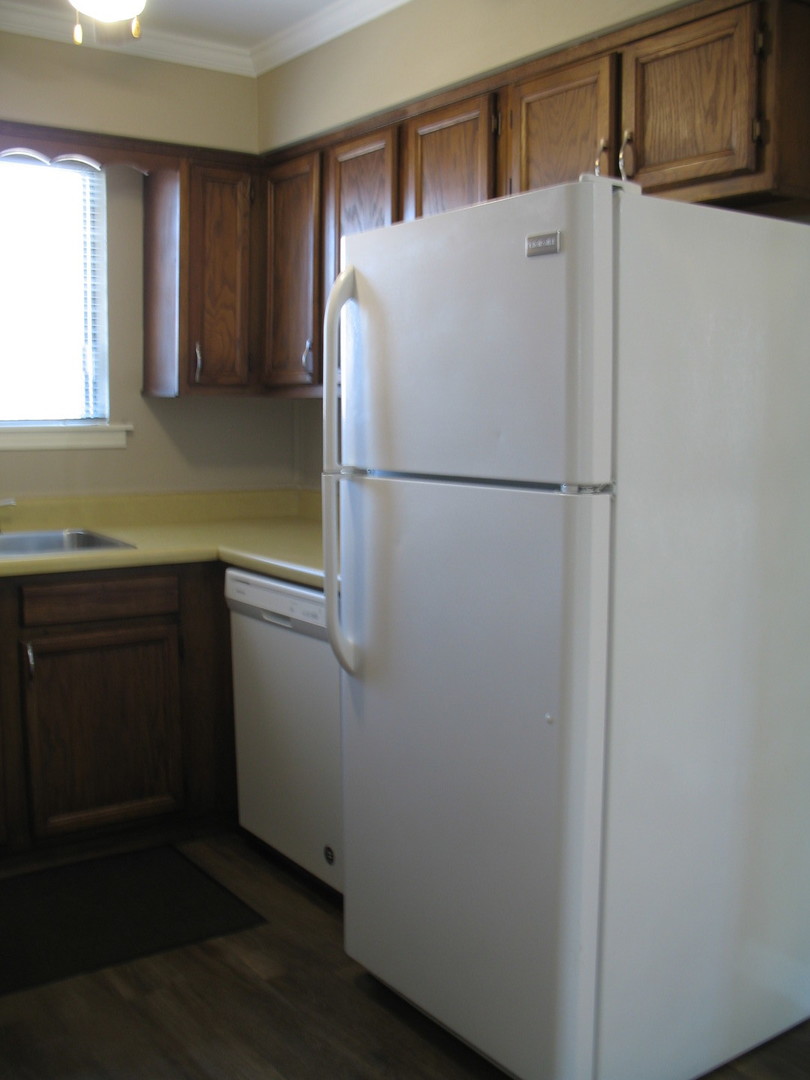 709 65th Street, Unit 5 Westmont, IL 60559 - Photo 8 of 15 a white refrigerator freezer sitting inside of a kitchen