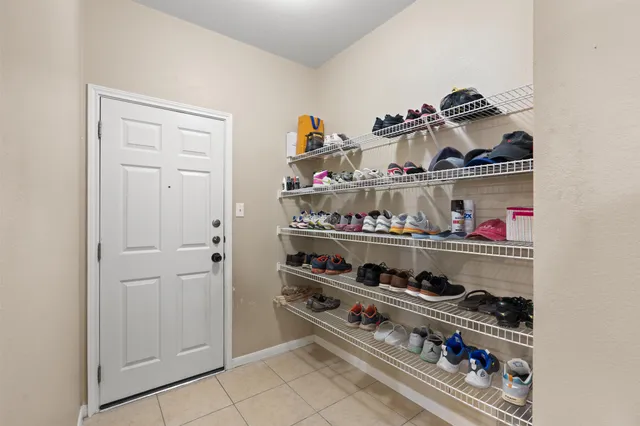 a spacious bathroom with a double vanity sink mirror and shower