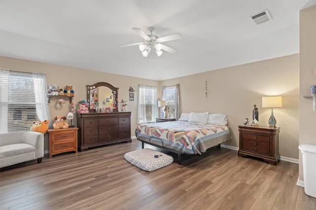 a bedroom with a bed and a dresser