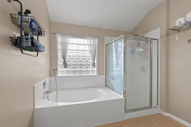 a white bath tub sitting next to a window